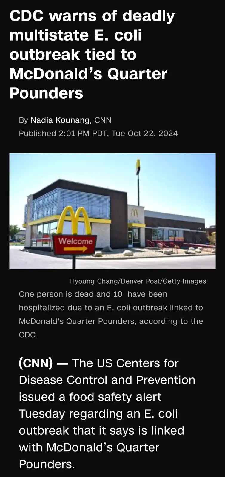 The image displays a screenshot of a fake CNN news article with a headline claiming the CDC warns of a deadly E. coli…
