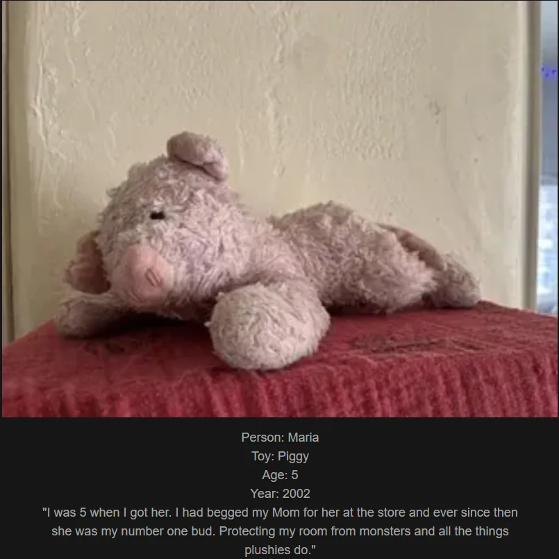 A slightly worn, light pink plush pig toy lies on its side on a red textured surface, with a plain wall behind it. Overlaid…