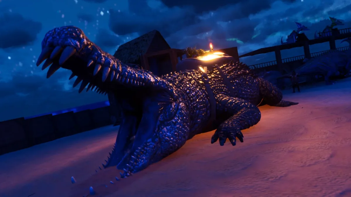 A giant, blue-scaled crocodile lies on a sandy beach at night, its back illuminated by a small candle. The scene includes…