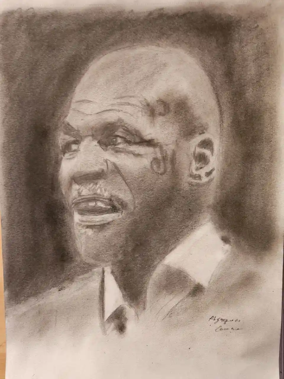 A charcoal sketch of a bald Black man with a mustache, wearing a collared shirt and tie, looking upward with an intense…