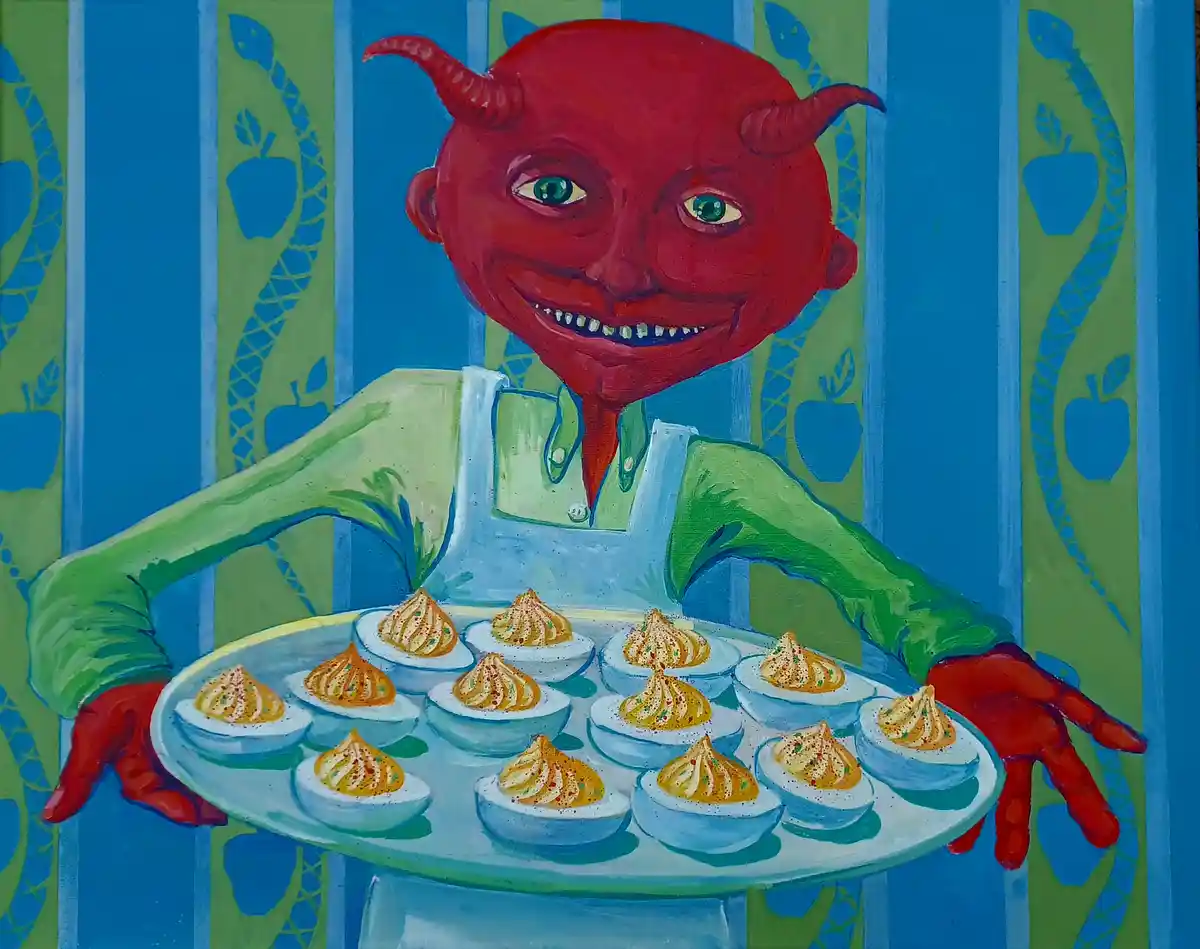A cartoonish red devil with horns and a wide grin, wearing green overalls, holds a tray of deviled eggs. The background…