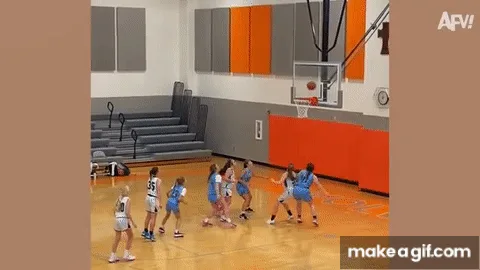 A sequence of frames from a basketball game shows a player in a white jersey with the number 30 standing still while her…