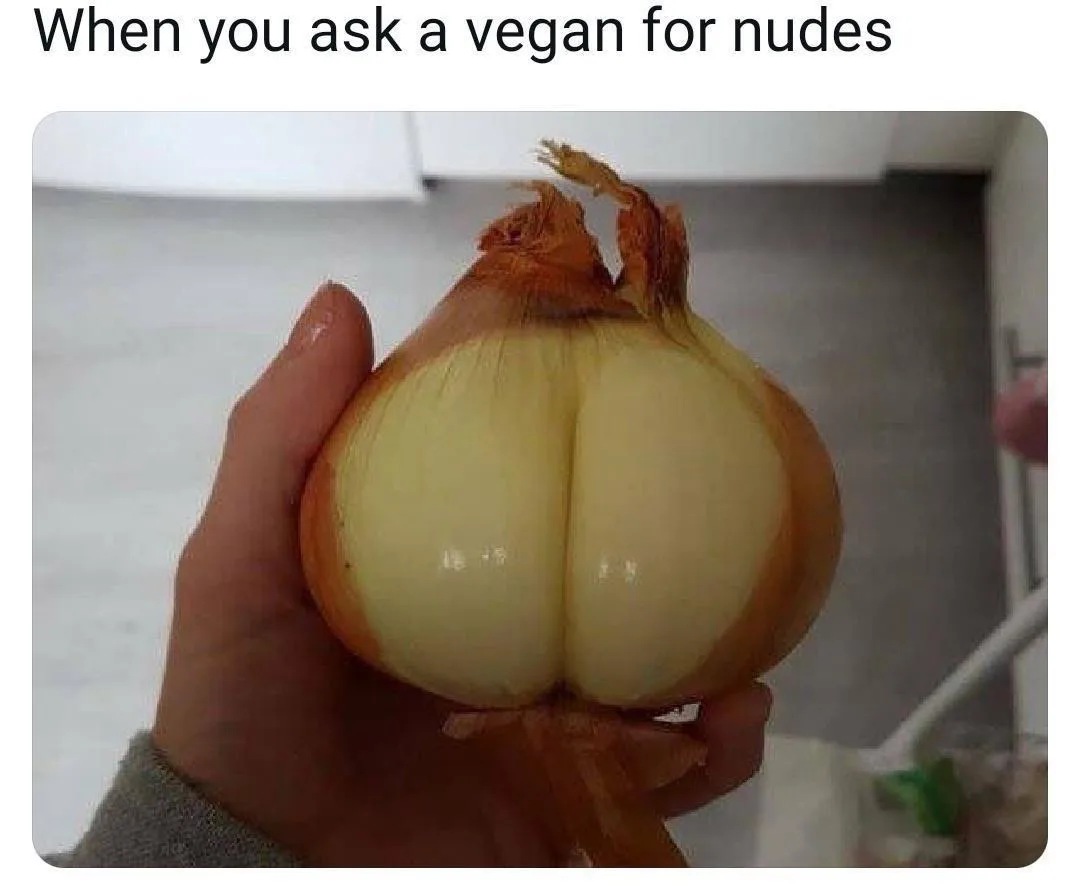 A hand holds a yellow onion that has been sliced to reveal a natural split resembling human buttocks. The overlaid text…