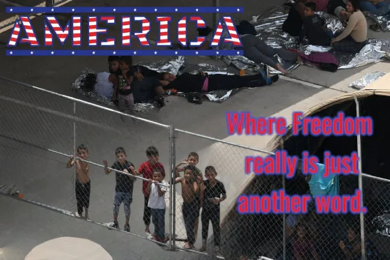 An aerial photo shows children standing behind a chain-link fence, while adults lie on the ground covered in silver thermal…