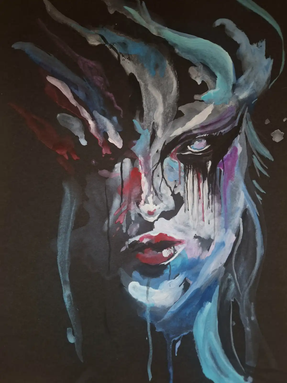 A watercolor painting depicts a stylized, haunting female face with dramatic makeup, tears streaming down her cheeks, and…