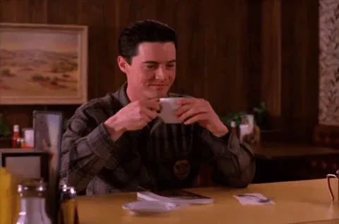 A six-panel image sequence shows a man in a plaid shirt drinking from a white cup at a diner table. In the first three…