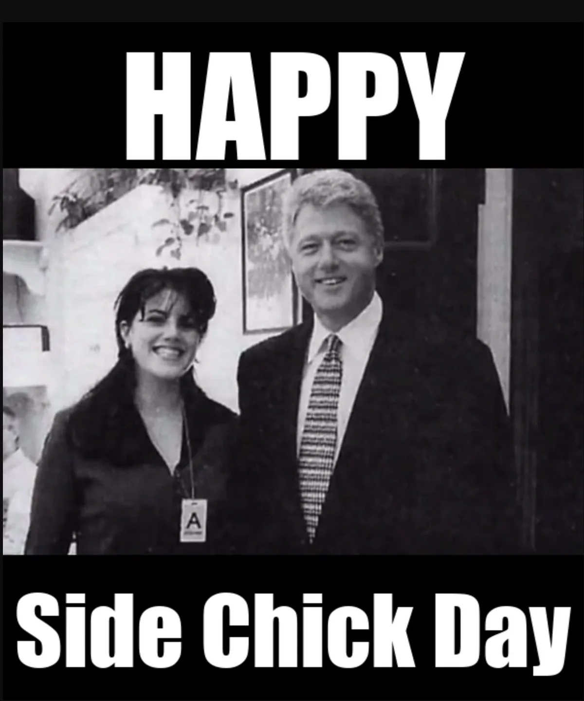 A black-and-white photo shows former U.S. President Bill Clinton smiling beside a woman wearing a name tag with the letter…