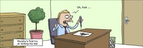 A cartoon man in a blue shirt and tie sits at a wooden desk, holding a pen and looking frustrated. He is staring at a jigsaw…