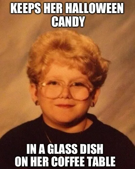 A vintage-style school photo of a young girl with curly blonde hair, large round glasses, and a slight smirk, wearing a dark…
