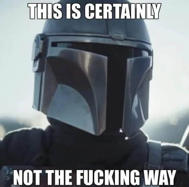 A close-up image of the Mandalorian character from Star Wars, wearing his iconic helmet and dark armor, looking forward with…