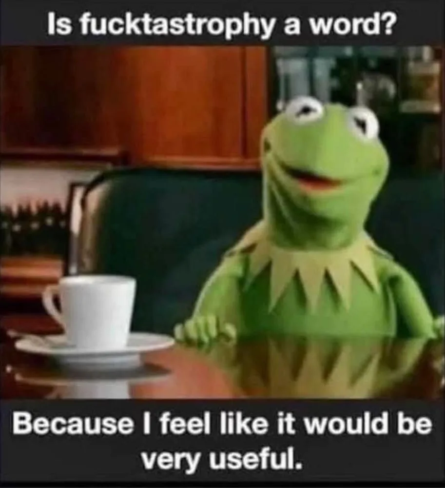 A still image of Kermit the Frog sitting at a table with a white coffee cup and saucer in front of him. He has a calm…