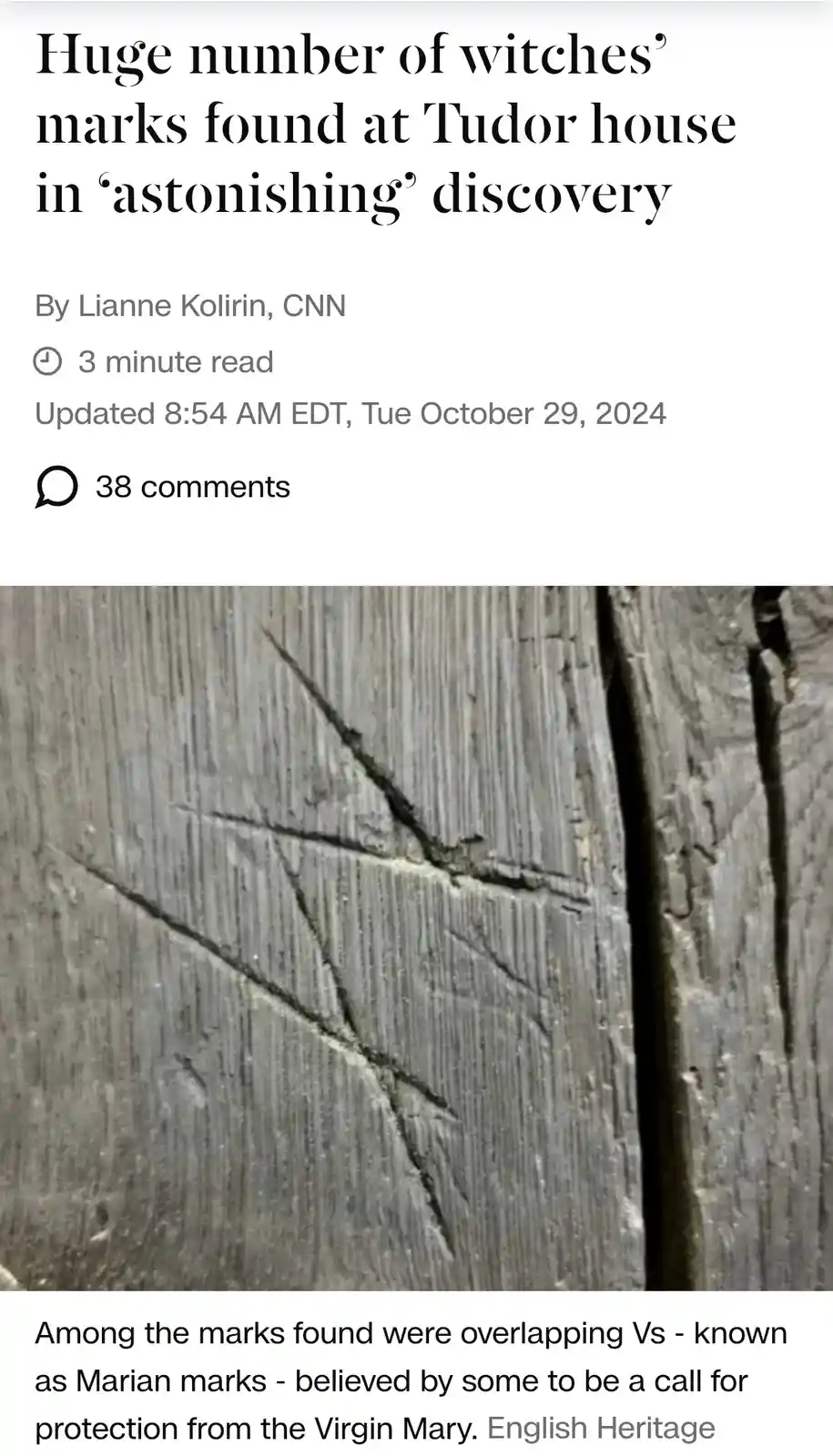 The image displays a screenshot of a CNN news article with a headline about 'witches' marks' found at a Tudor house. The…