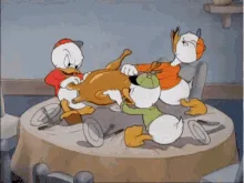 A sequence of six frames from a classic cartoon shows three duck characters struggling to carve a large roasted turkey on a…