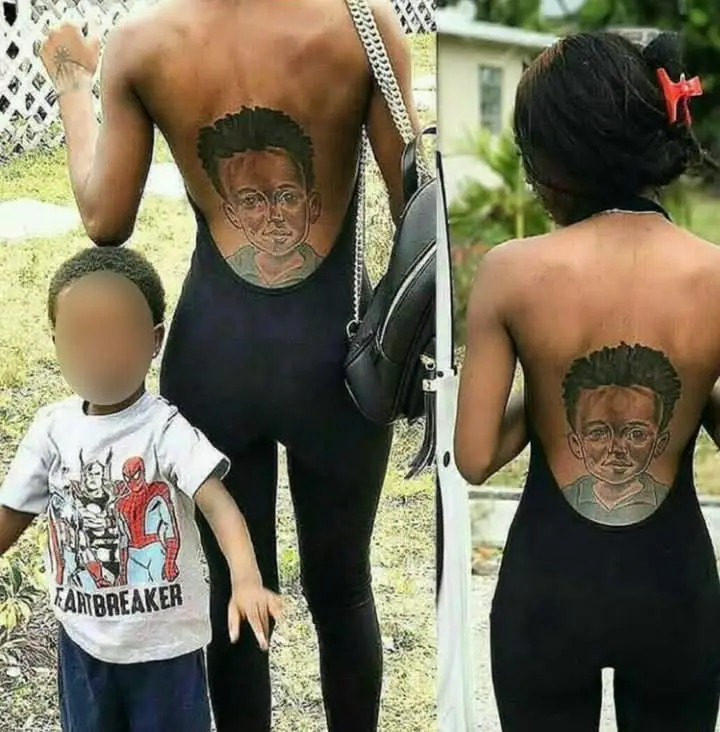The image shows two adults, a man and a woman, both with a tattoo of a young boy's face on their backs. The man is…