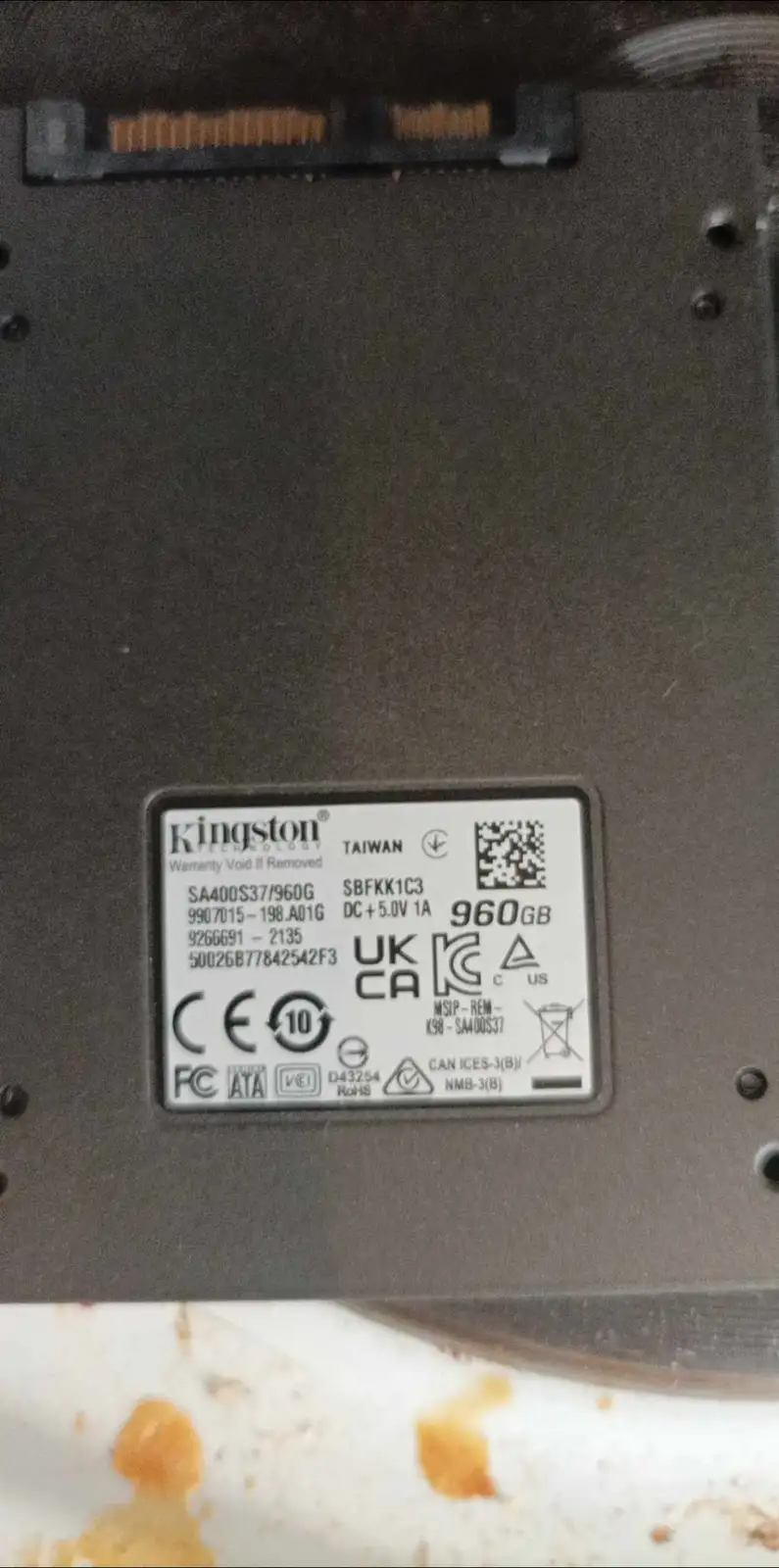 A close-up photo of a Kingston solid-state drive's label, which clearly displays '960GB' as its storage capacity. The label…