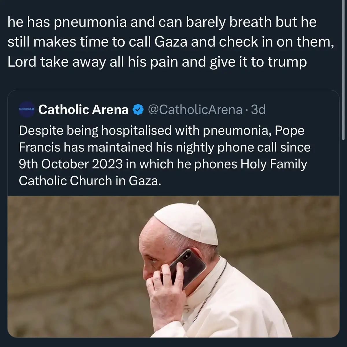 The image shows Pope Francis in his white papal attire, holding a smartphone to his ear as if on a call. Above the image is…
