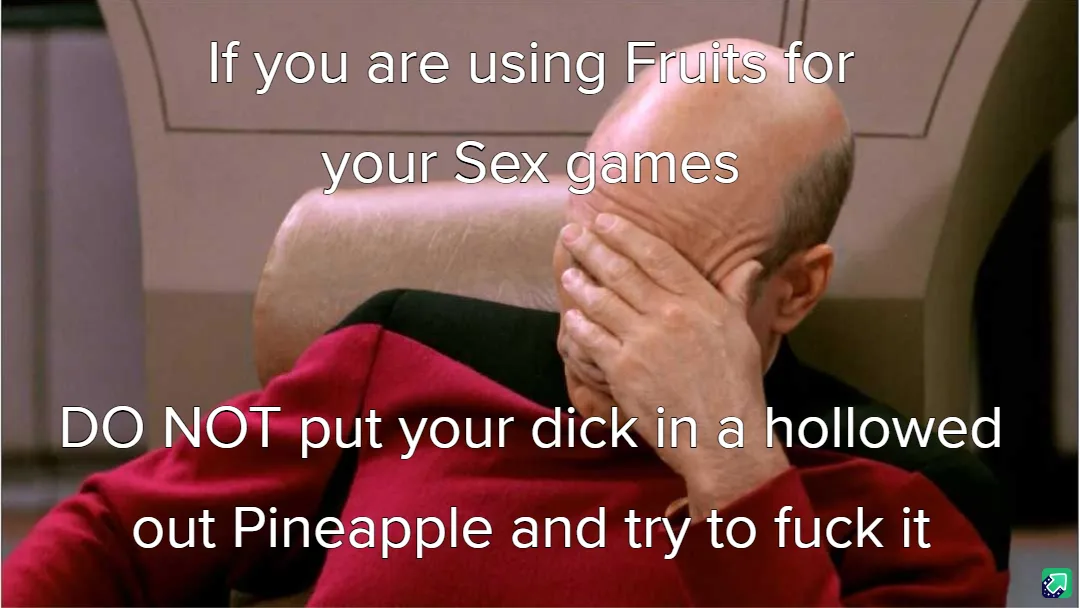 A bald man in a red Starfleet uniform sits in a chair, covering his face with his hand in a gesture of despair or…