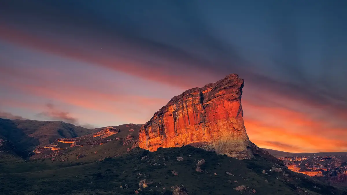 Approaching the Maloti Mountains, Southern Africa's highest peak, in Lesotho's tiny kingdom, we encounter dramatic sandstone…
