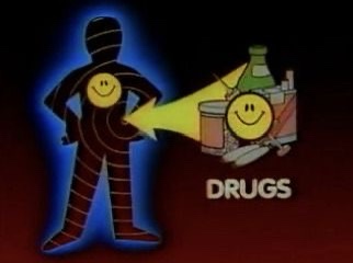 A cartoon ninja with a yellow smiley face on its chest points a yellow beam at a pile of items including a bottle and a can…