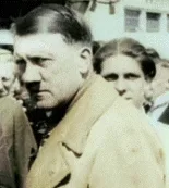 six identical photos of adolf hitler arranged in a 2x3 grid, each showing him in a tan coat with a slightly different facial…
