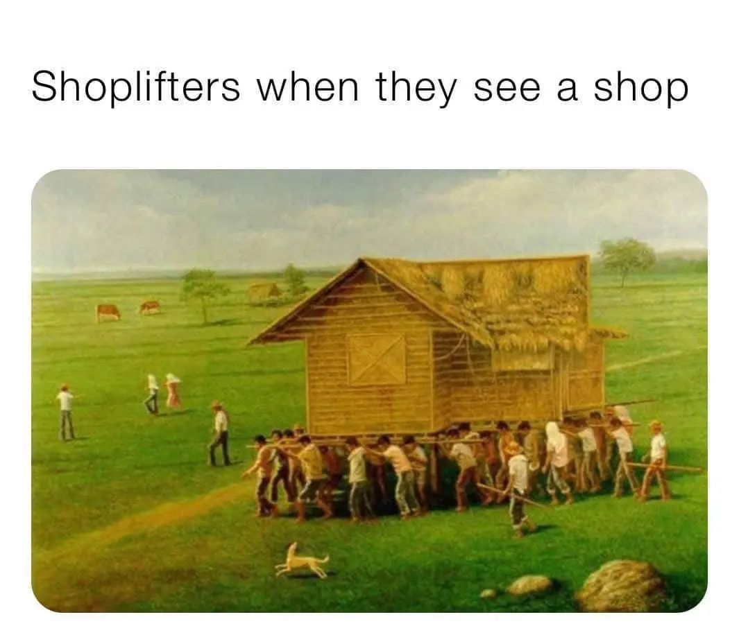 A painting depicts a large group of people in a field, collectively carrying a small wooden shack on their shoulders. The…