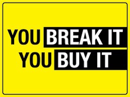 A bright yellow rectangular sign with a thin black border displays the text 'YOU BREAK IT YOU BUY IT' in bold black…