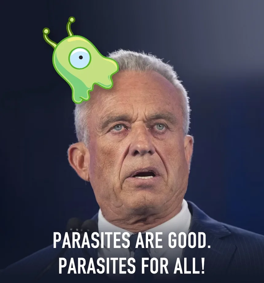 A close-up photo of an older man with gray hair, wearing a suit and tie, looking surprised or shocked. A cartoon green alien…