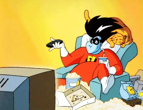 A cartoon character in a red superhero suit sits in a recliner, holding a remote, with a pizza box, popcorn, and a drink…