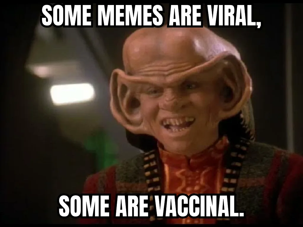 A close-up of a bald, alien character with large, pointed ears and a menacing grin, wearing a red and patterned uniform. The…