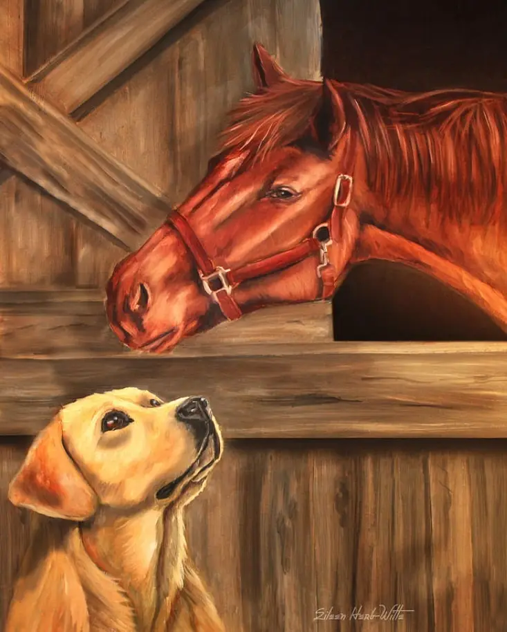 A painting depicts a brown horse wearing a red halter, peeking over a wooden stable door at a yellow Labrador retriever…