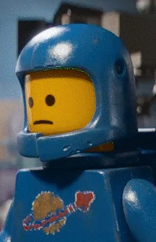 A six-panel image sequence from 'The Lego Movie' showing a blue astronaut Lego minifigure's emotional journey. The panels…