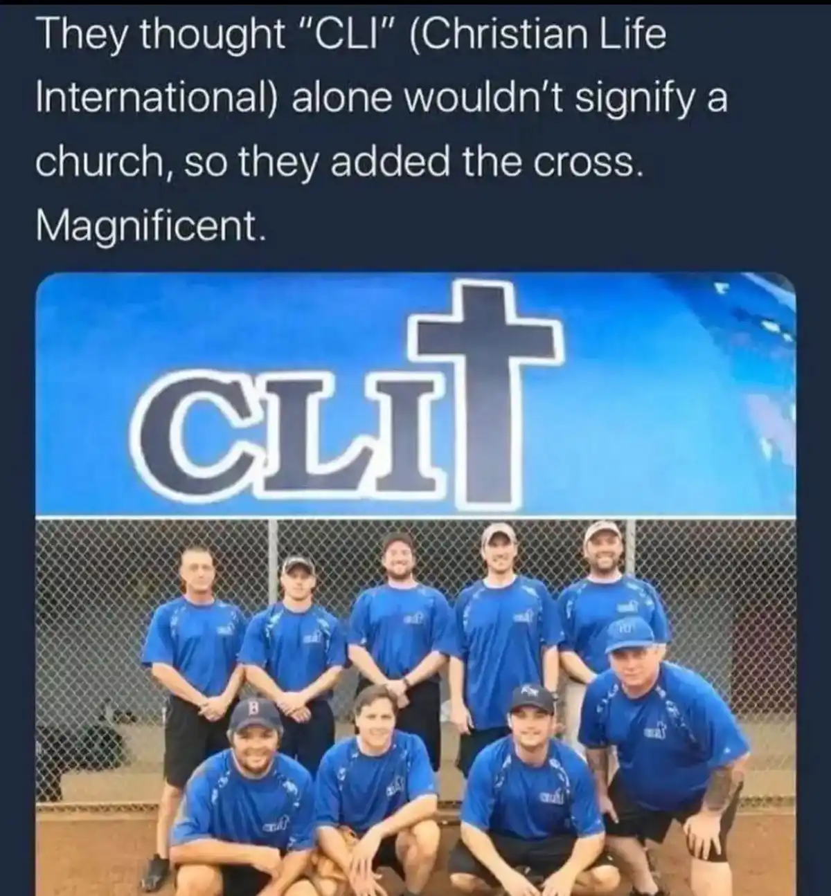 A group photo of nine men in matching blue athletic shirts posing in front of a blue sign that reads 'CLI' with a large…