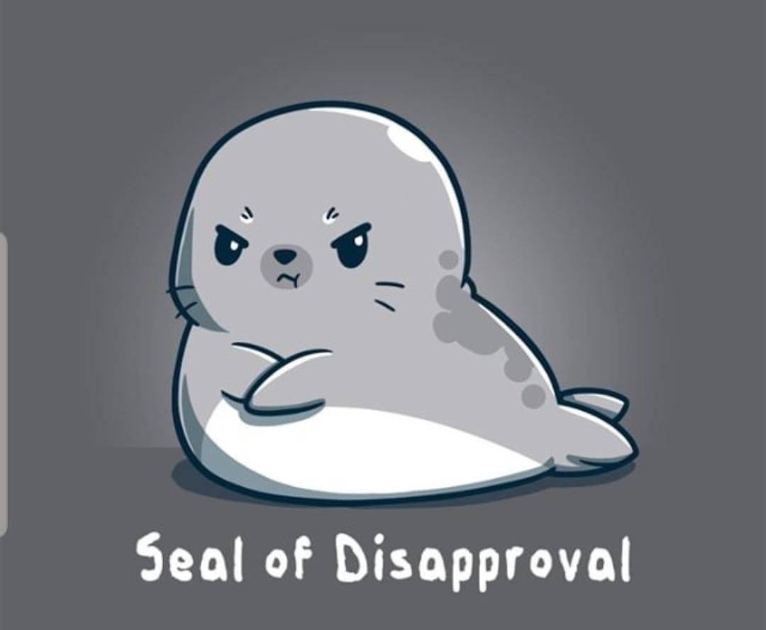 A cartoon seal with a grumpy, disapproving expression, arms crossed, sitting on a gray background. The text below reads…