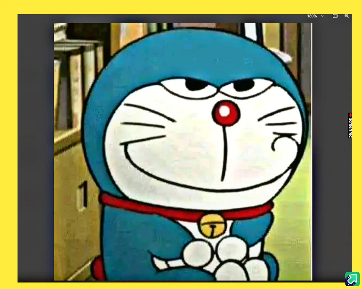 a close-up of the cartoon character Doraemon, who has a smug, self-satisfied expression with one eye closed and a slight…