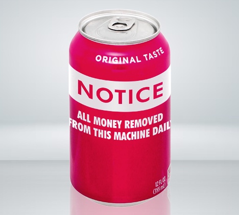 A red soda can with a white label that reads 'ORIGINAL TASTE' at the top, 'NOTICE' in large bold letters, and 'ALL MONEY…