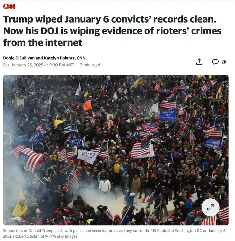 An aerial photo shows a large crowd of people, many holding American flags and 'TRUMP' signs, amidst smoke, during the…