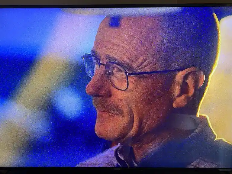 A close-up profile shot of a man with glasses and a mustache, looking to the left, overlaid with the text 'i'm not a fan of…