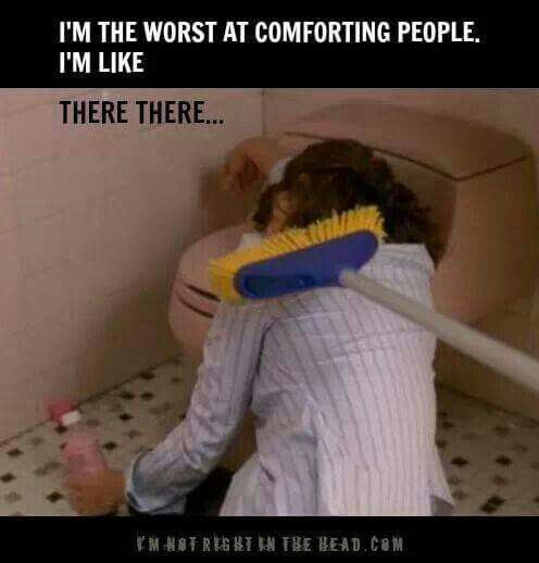 A person in a striped shirt is seen from behind, hunched over a toilet in a bathroom, holding a toilet brush with a yellow…