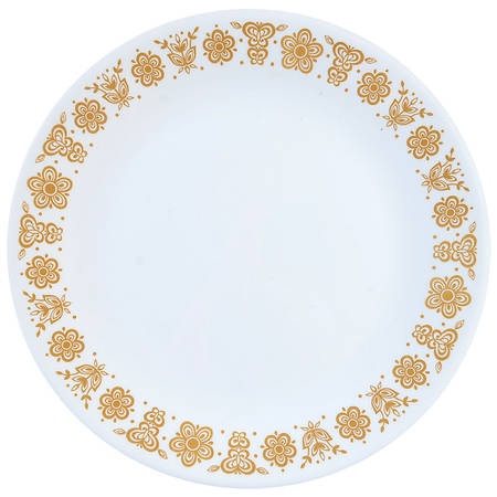 A white ceramic plate with a decorative gold floral border around the rim, featuring repeating flower and leaf patterns. The…