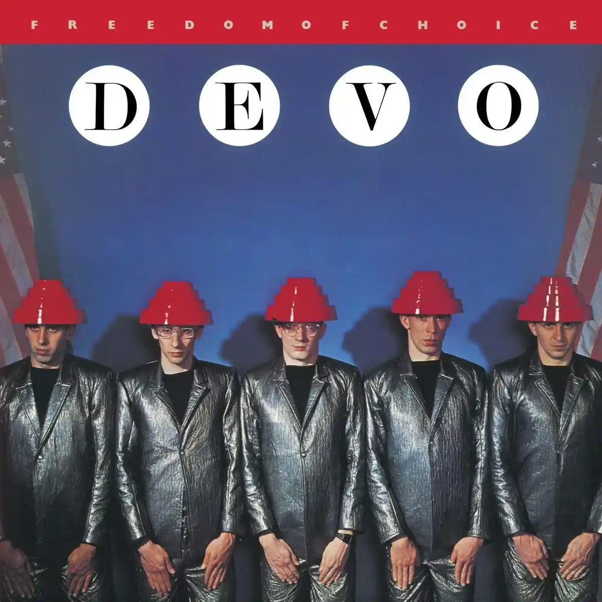 The image shows the album cover for Devo's 'Freedom of Choice,' featuring five identical-looking men in silver metallic…