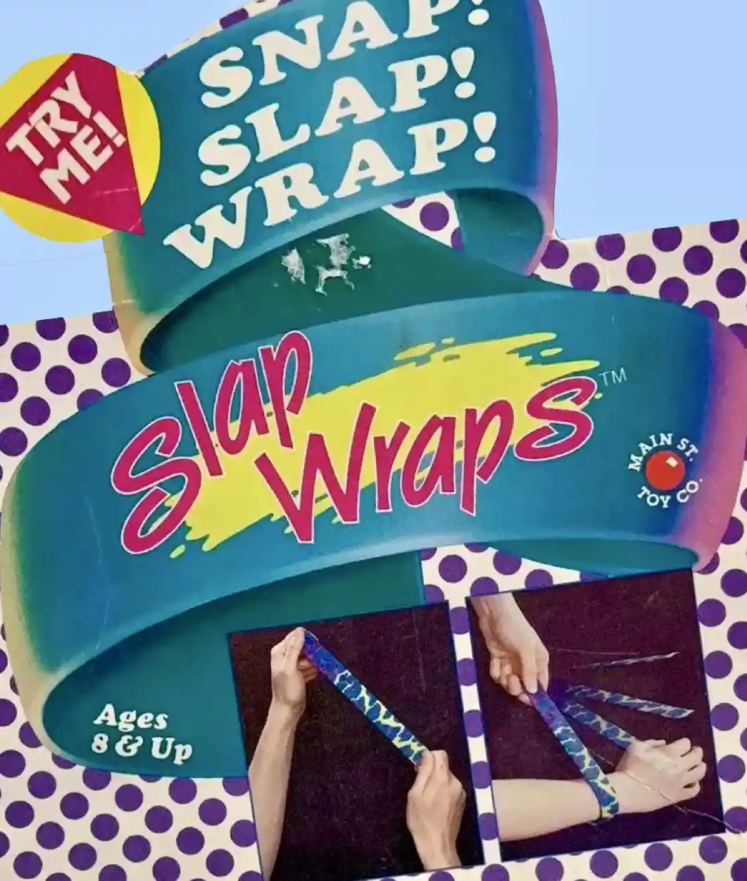 The image shows a vintage toy box for 'Slap Wraps' by Main St. Toy Co., featuring a blue ribbon design with purple polka…