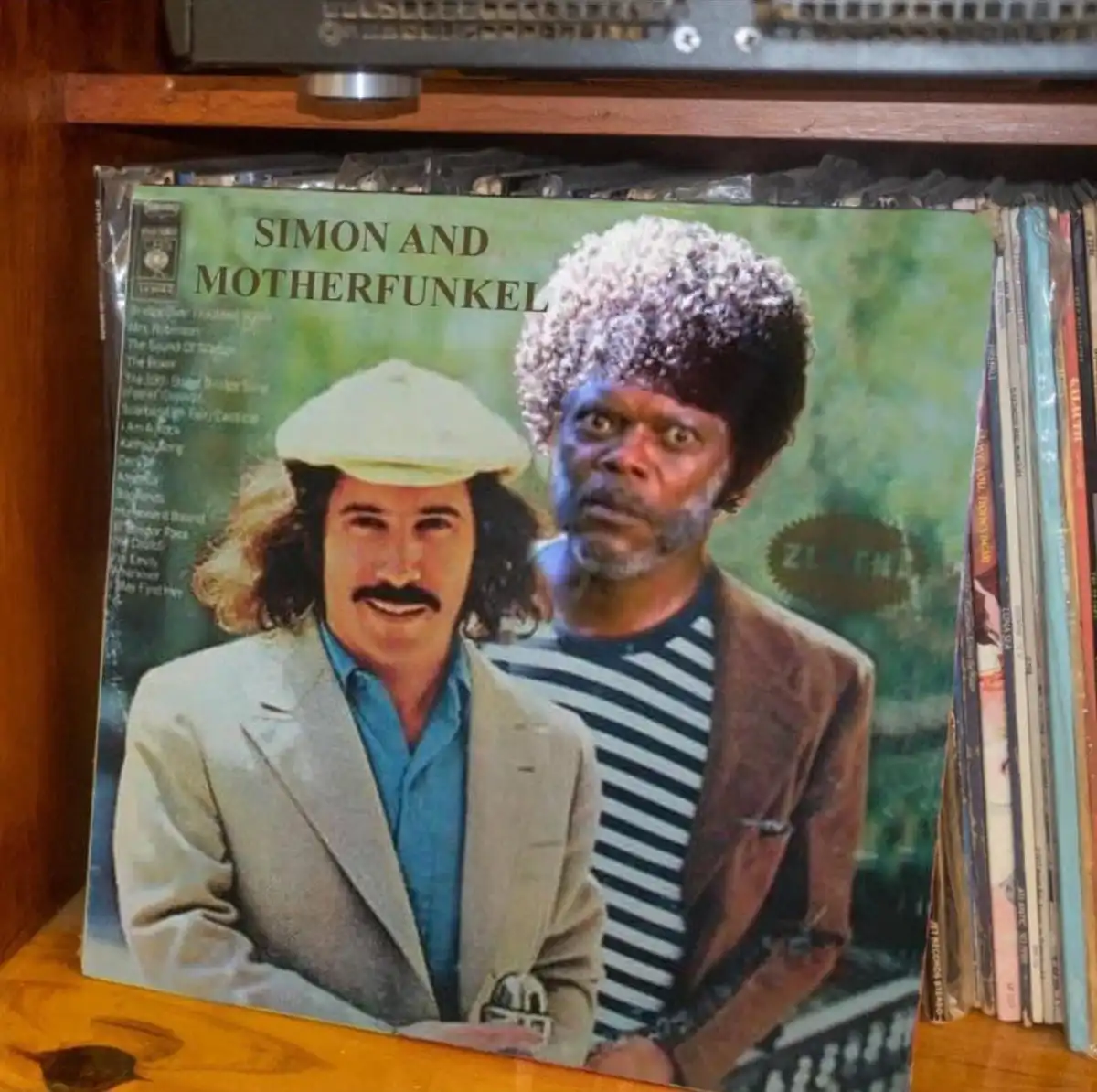 A vinyl record album cover featuring two men, one smiling with a mustache and hat, the other with a shocked expression and…