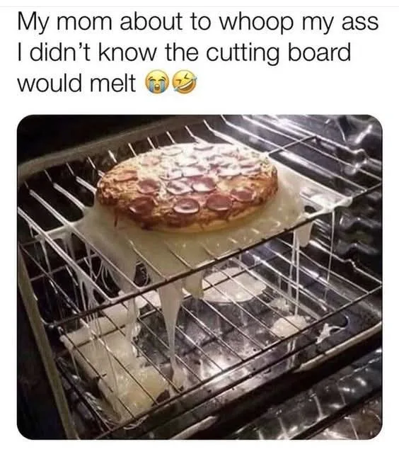 A pizza sits on a cutting board inside an oven, with the board visibly melted and dripping wax-like substance onto the oven…
