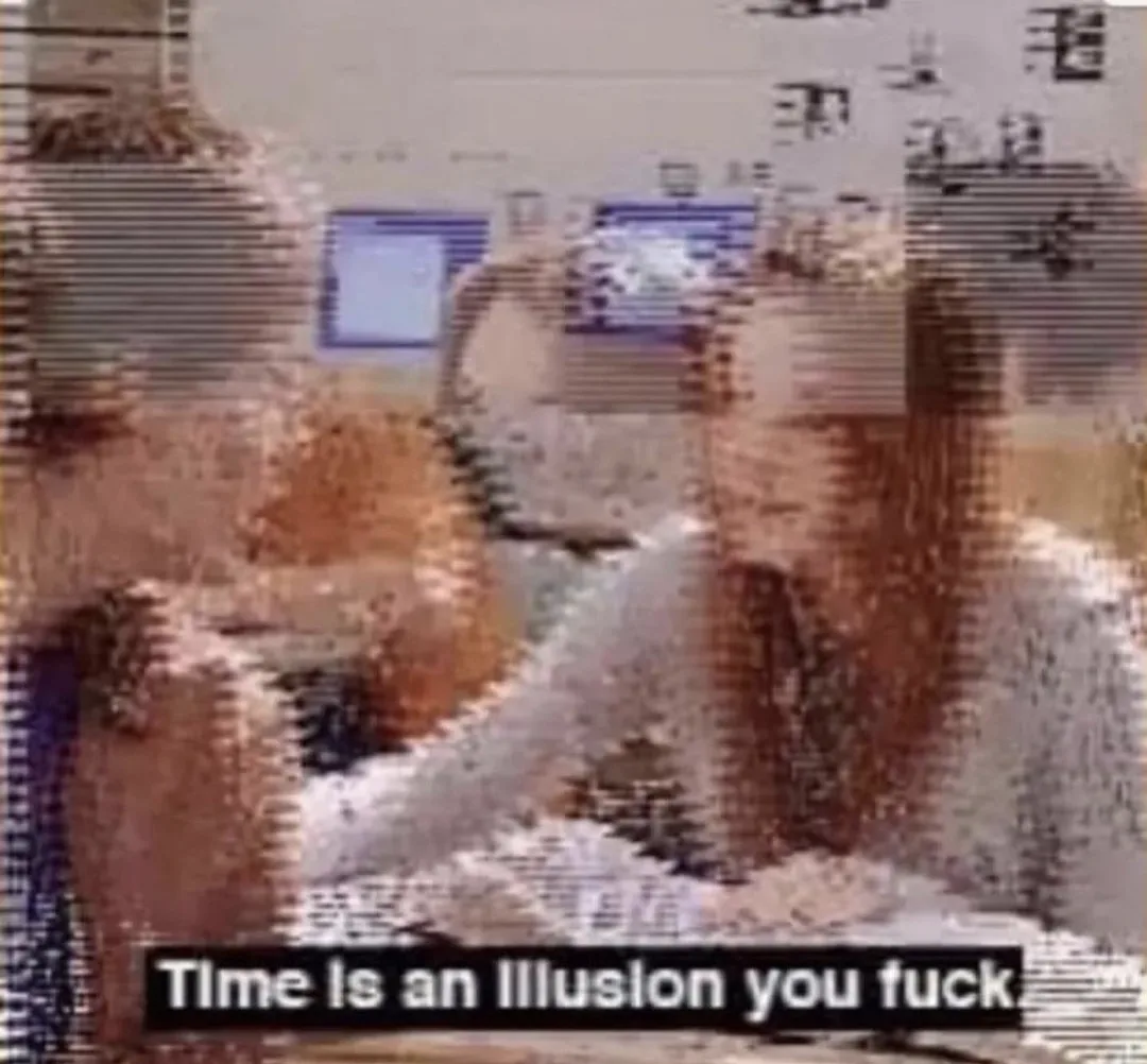 A heavily pixelated and distorted image of a person sitting at a computer with two monitors, overlaid with the text 'Time is…