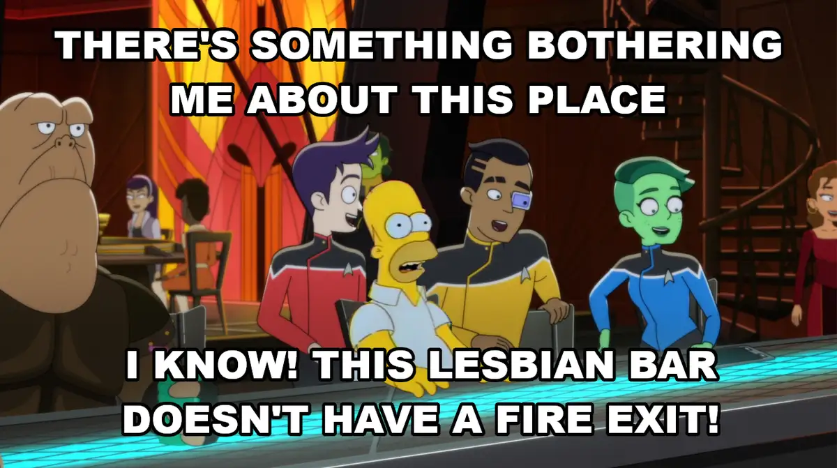 The image shows Homer Simpson sitting at a bar with several Star Trek characters, including a green-skinned alien and a man…