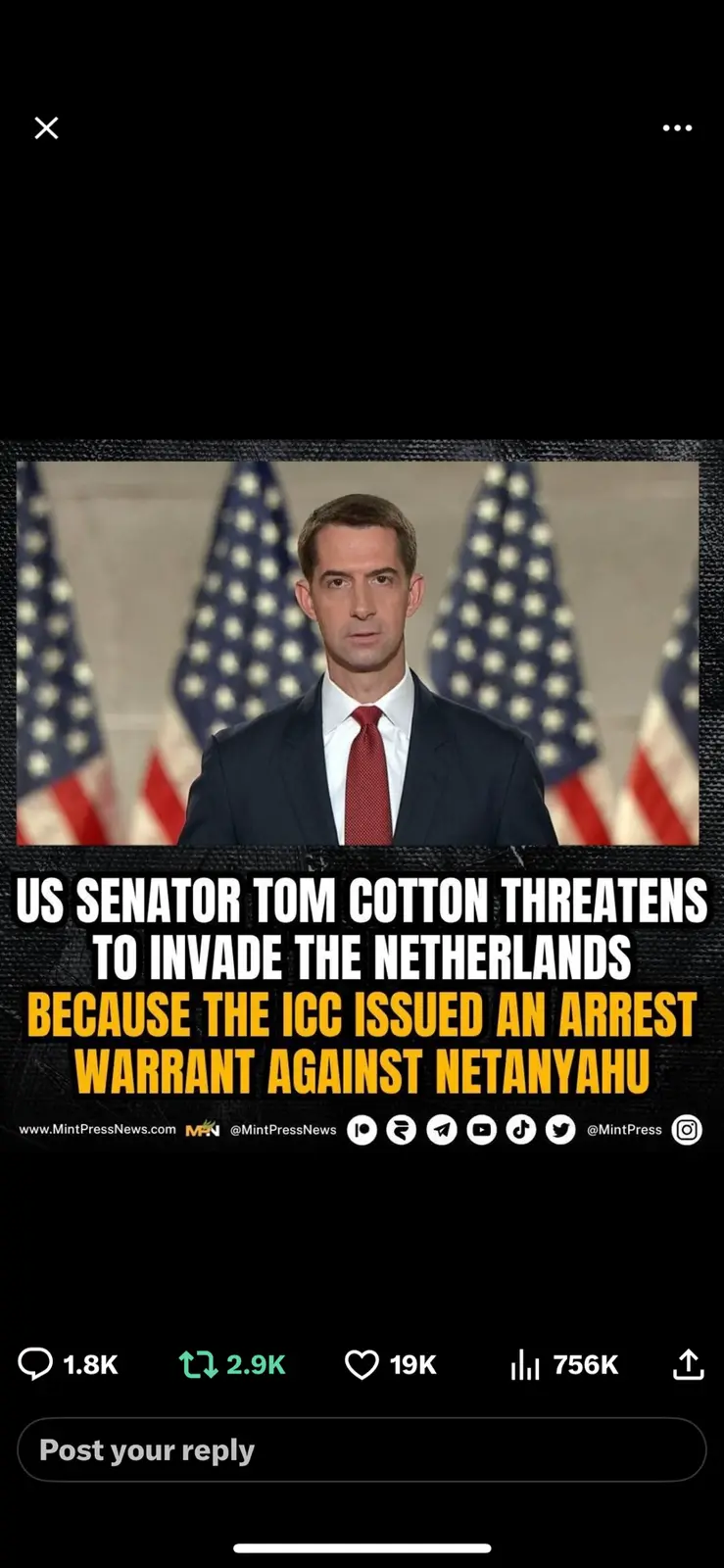 A still image of US Senator Tom Cotton in a suit and red tie, standing in front of American flags. Overlaid text in bold…
