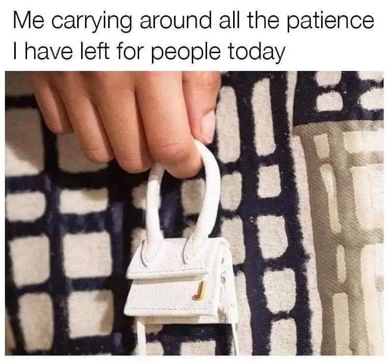 A hand holds a tiny white handbag with a gold 'J' logo, symbolizing the last bit of patience someone has left for others…