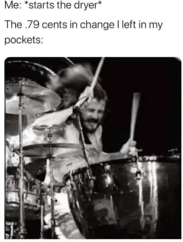 A black-and-white photo shows a drummer energetically playing with motion blur, smiling broadly while holding drumsticks…