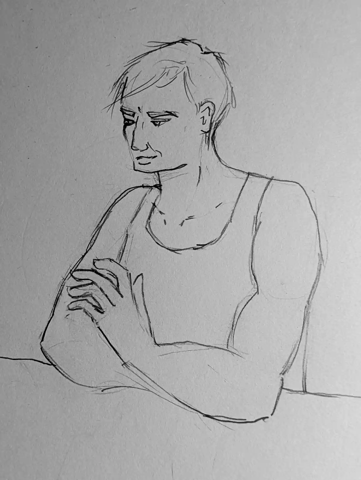 A simple black-and-white pencil sketch depicts a person with short hair, wearing a tank top, sitting with arms crossed and…