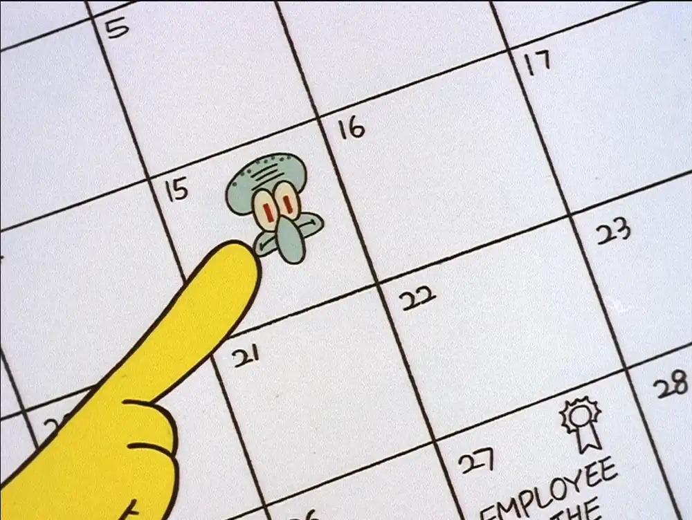 A close-up of a cartoon calendar shows a yellow finger pointing at a small, green, cartoonish squid character drawn inside…